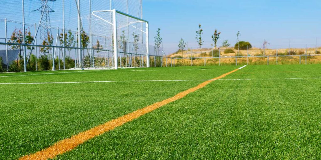 Football Field Construction with Artificial Grass